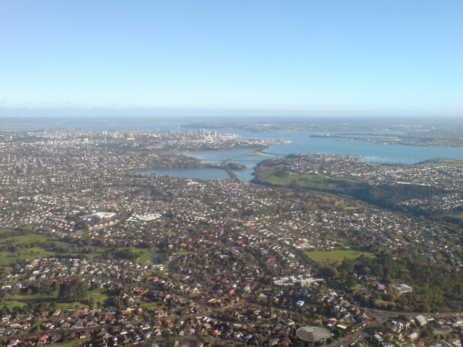 Auckland travel planning photo showing The eastern suburbs (foreground) and the City CBD of Auckland City, New Zealand