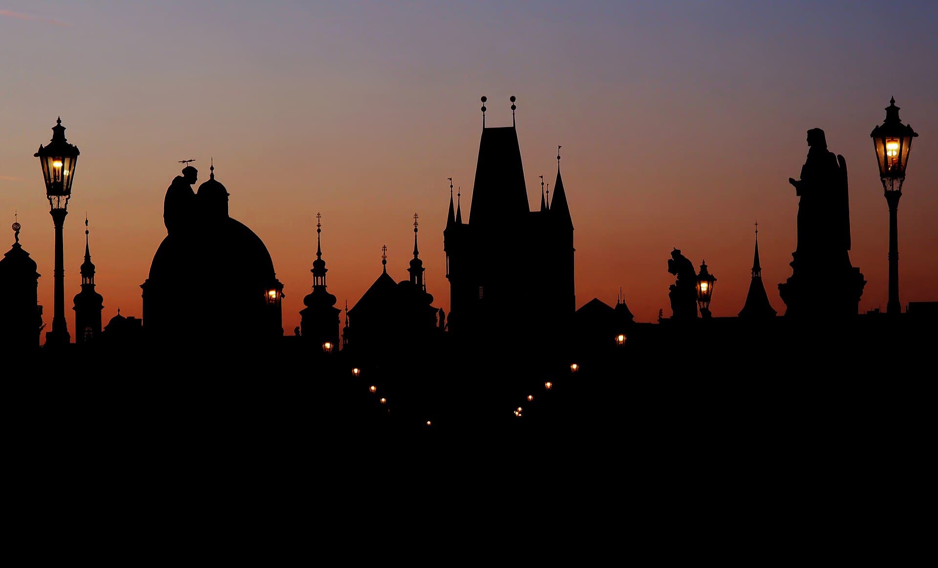 Prague travel planning photo showing Prague skyline at dawn. View from Charles bridge to the East