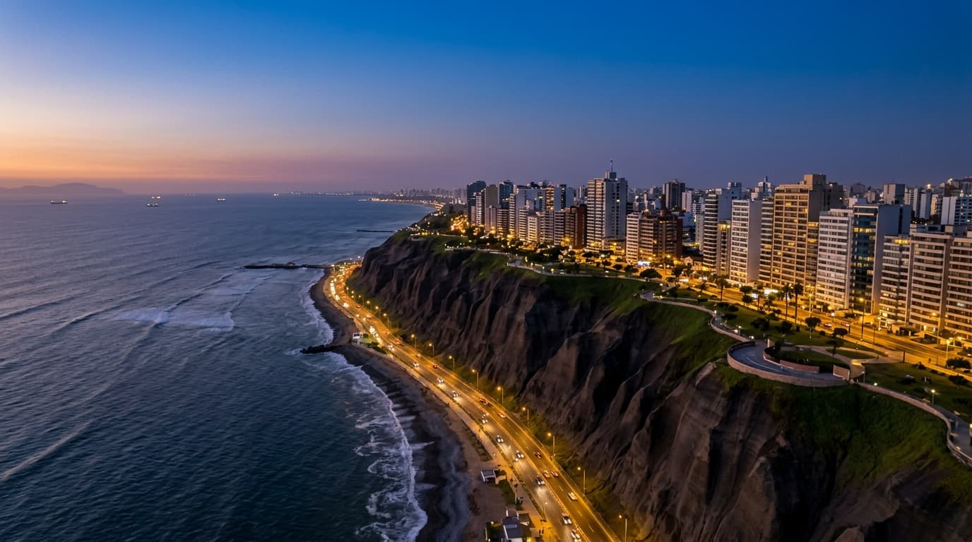 Lima coastal cliffs and Pacific skyline at Miraflores under warm evening haze
