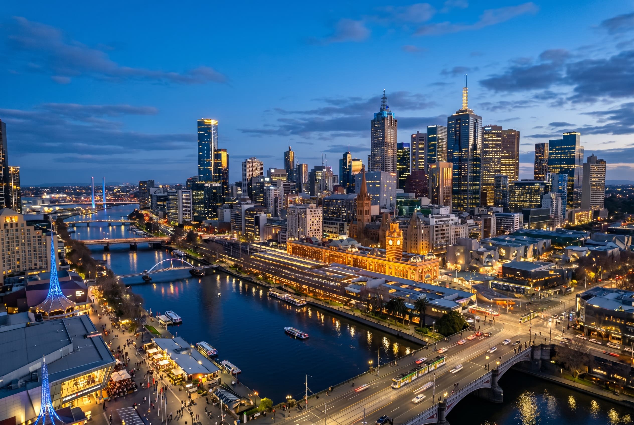 Melbourne skyline with the Yarra River and dense city towers at blue hour
