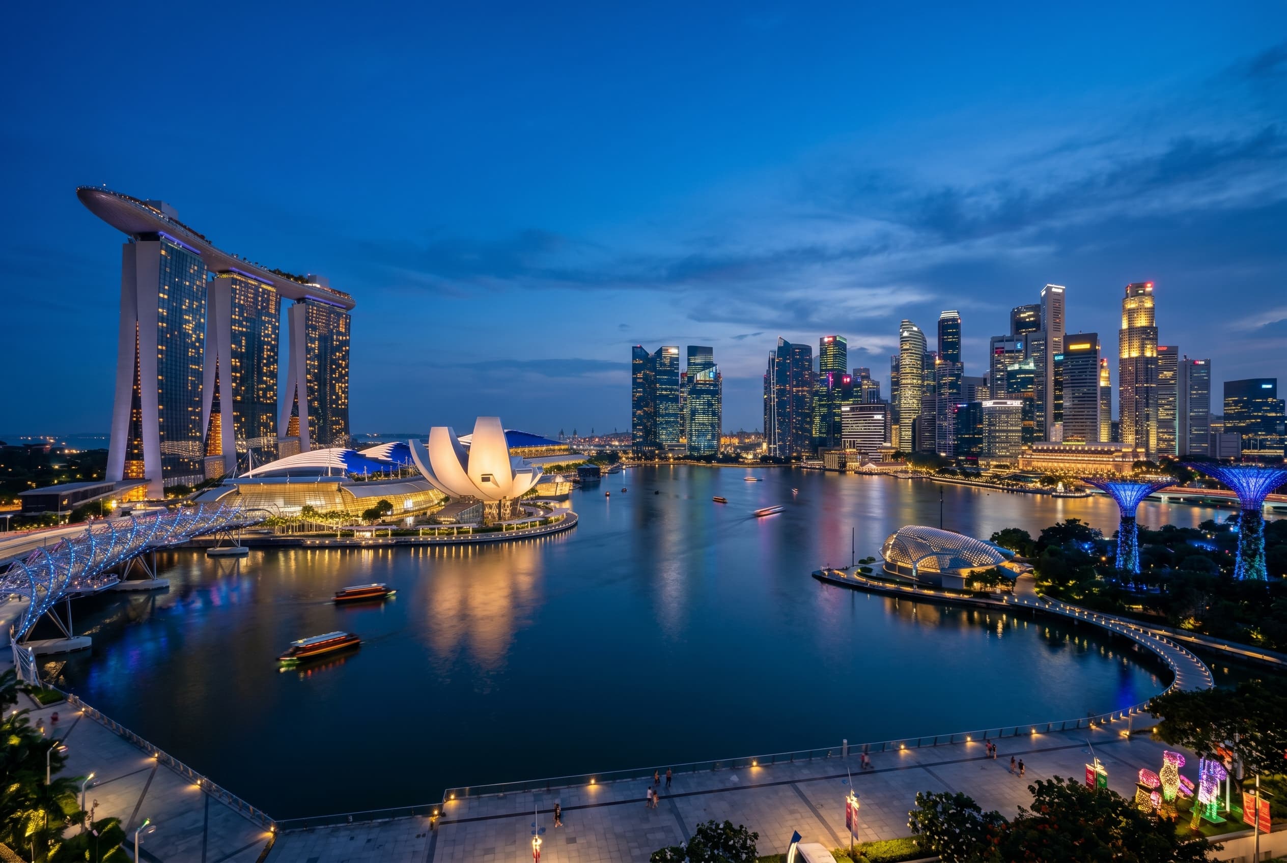 Singapore Marina Bay skyline at blue hour with illuminated towers and waterfront reflections
