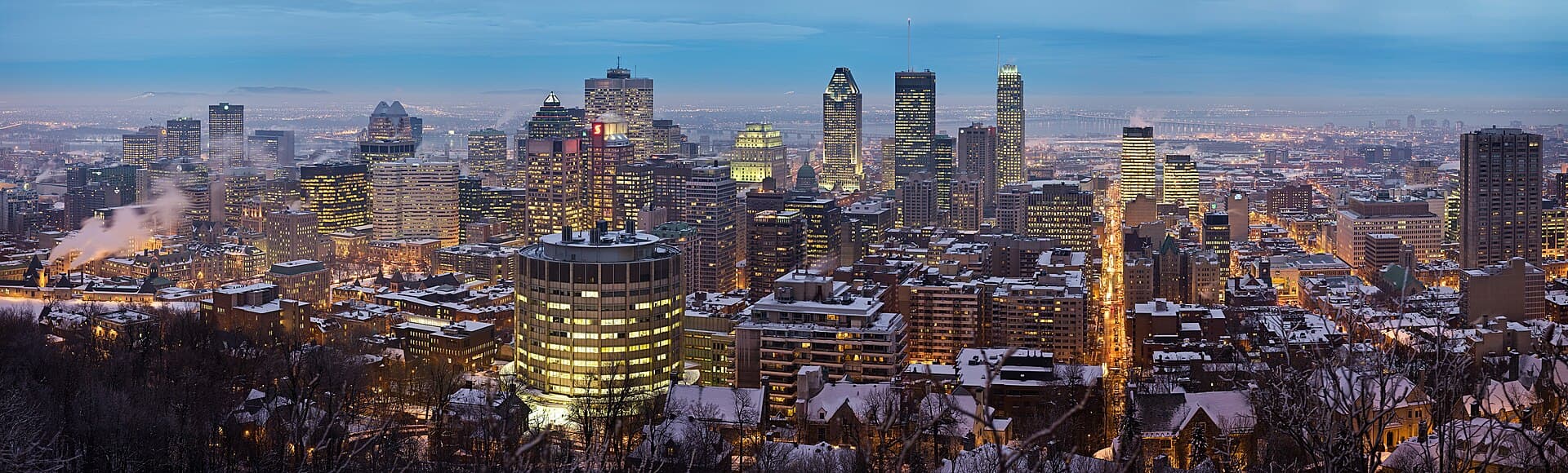 Montreal travel planning photo showing A panorama of the city, taken from the Chalet du Mont Royal at the top of Mount Royal in Montreal. It is a 3x5 segment panorama taken with a